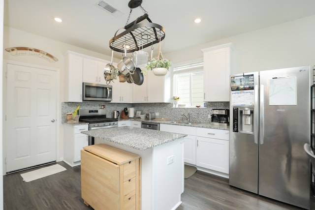 12626 Baker Bend St, Houston, TX 77034 - kitchen featuring a center island, a sink, dark wood-style flooring, and stainless steel appliances