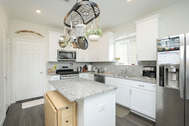 12626 Baker Bend St, Houston, TX 77034 - kitchen with decorative backsplash, stainless steel appliances, and dark wood-style flooring