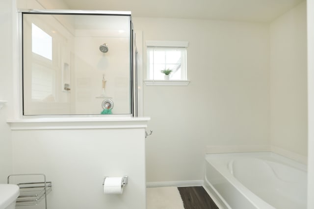 12626 Baker Bend St, Houston, TX 77034 - bathroom featuring baseboards, a shower stall, toilet, and a bath