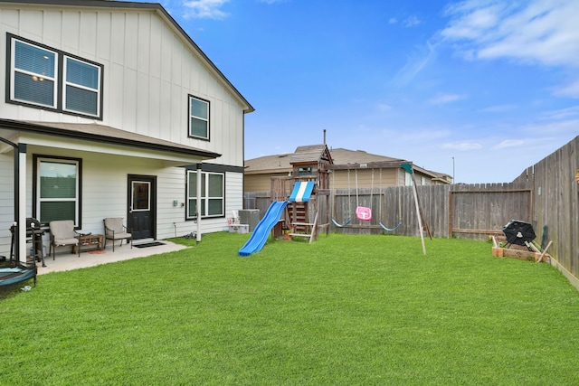 12626 Baker Bend St, Houston, TX 77034 - view of yard featuring a patio, a fenced backyard, a playground, and central AC unit