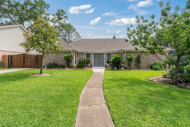 15110 Falling Creek Dr, Houston, TX 77068 - ranch-style home featuring brick siding, a gate, a front yard, and a shingled roof