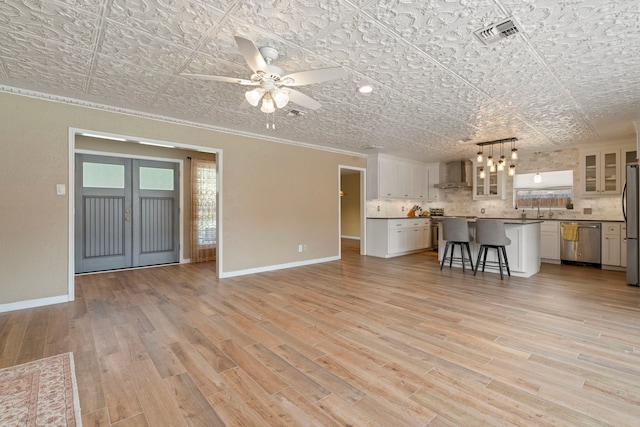 15110 Falling Creek Dr, Houston, TX 77068 - unfurnished living room featuring an ornate ceiling, baseboards, ornamental molding, light wood finished floors, and ceiling fan
