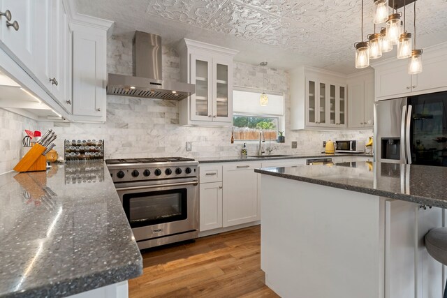15110 Falling Creek Dr, Houston, TX 77068 - kitchen with wall chimney range hood, stainless steel appliances, a sink, an ornate ceiling, and backsplash