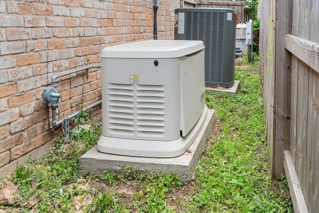 15110 Falling Creek Dr, Houston, TX 77068 - exterior view of a power unit, central air condition unit, fence, and brick siding