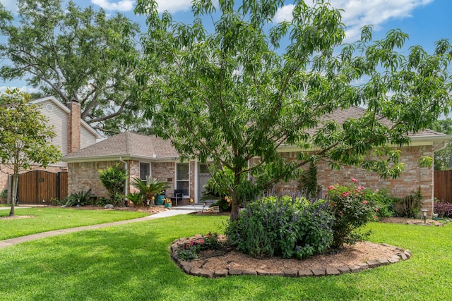 15110 Falling Creek Dr, Houston, TX 77068 - view of front of property with brick siding, roof with shingles, and a gate