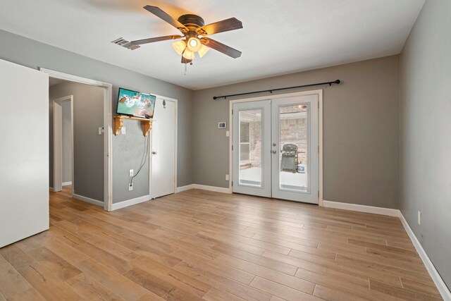 15110 Falling Creek Dr, Houston, TX 77068 - empty room with french doors, ceiling fan, light wood-style flooring, and baseboards