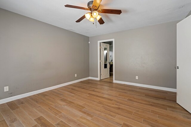 15110 Falling Creek Dr, Houston, TX 77068 - spare room featuring ceiling fan, light wood-style flooring, and baseboards