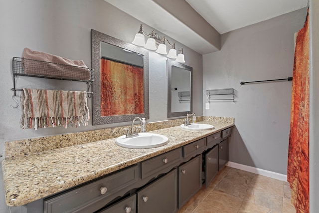 15110 Falling Creek Dr, Houston, TX 77068 - bathroom with double vanity, tile patterned floors, and baseboards