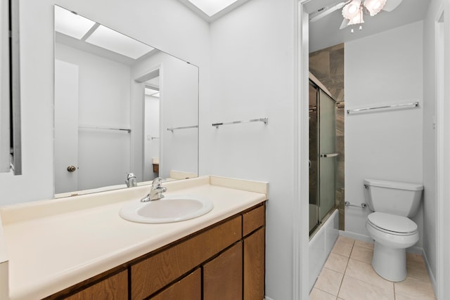 full bath with tile patterned flooring, toilet, shower / bath combination with glass door, and vanity