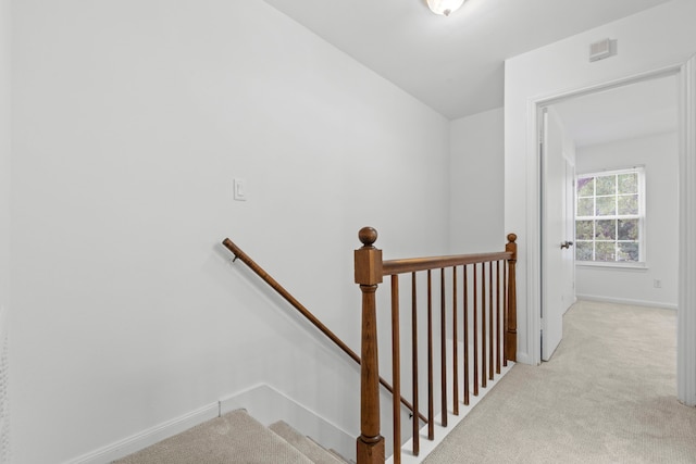 staircase with carpet and baseboards