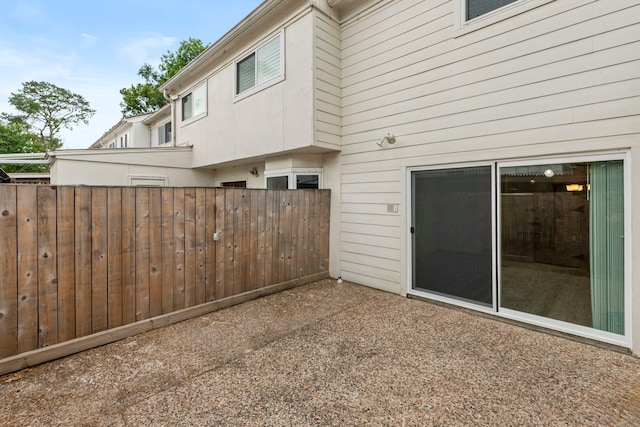 view of patio featuring fence