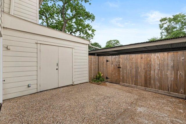 view of shed with fence