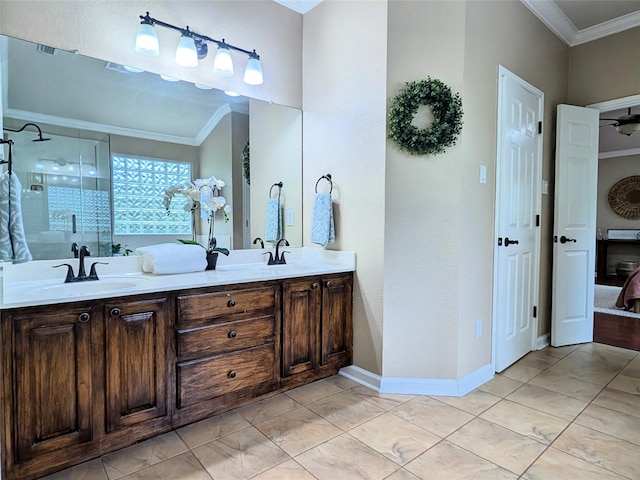 full bathroom with crown molding, a sink, double vanity, baseboards, and a stall shower
