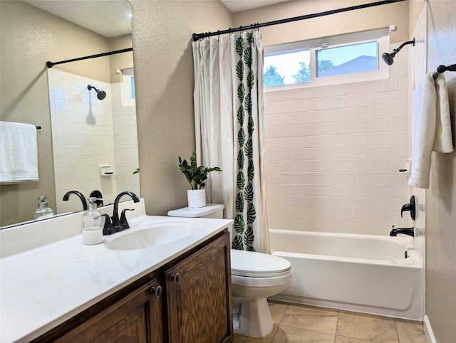 bathroom featuring vanity, a textured wall, toilet, and shower / tub combo with curtain