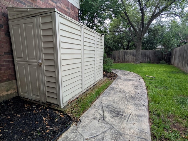 view of outdoor structure with a fenced backyard