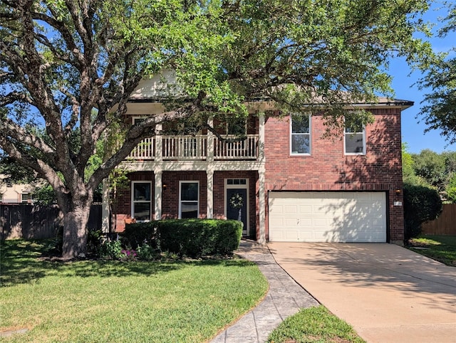 view of front of property featuring brick siding, an attached garage, fence, and driveway