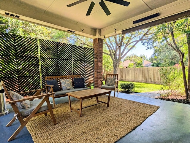 view of patio featuring a fenced backyard, a ceiling fan, and an outdoor hangout area