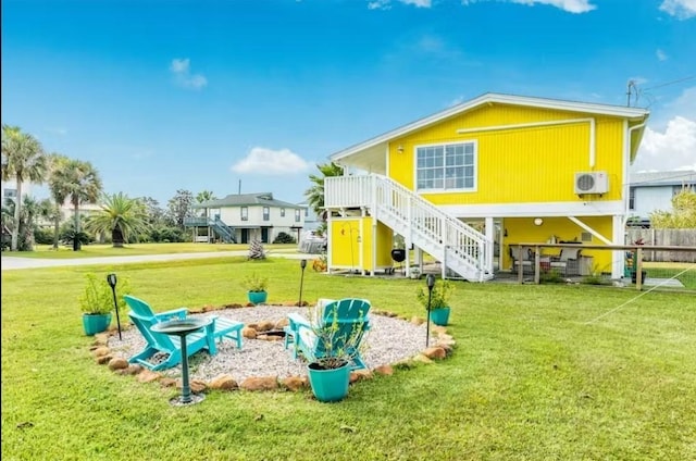 16530 Jean Lafitte Rd, Jamaica Beach, TX 77554 - view of jungle gym featuring ac unit, a yard, a fire pit, and stairway
