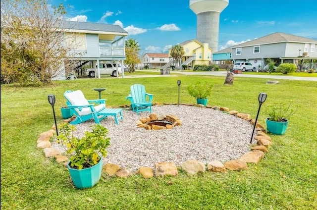 16530 Jean Lafitte Rd, Jamaica Beach, TX 77554 - view of yard with a residential view and an outdoor fire pit