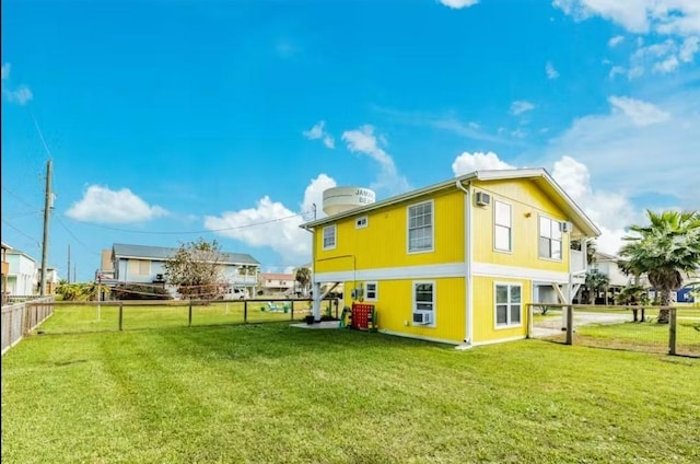 16530 Jean Lafitte Rd, Jamaica Beach, TX 77554 - rear view of property featuring a fenced backyard and a yard