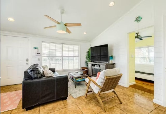 16530 Jean Lafitte Rd, Jamaica Beach, TX 77554 - living area with crown molding, light tile patterned floors, a ceiling fan, and a wealth of natural light