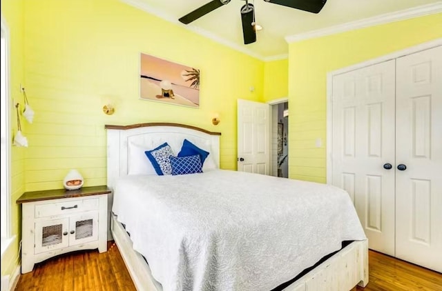 16530 Jean Lafitte Rd, Jamaica Beach, TX 77554 - bedroom featuring a closet, ornamental molding, dark wood finished floors, and ceiling fan