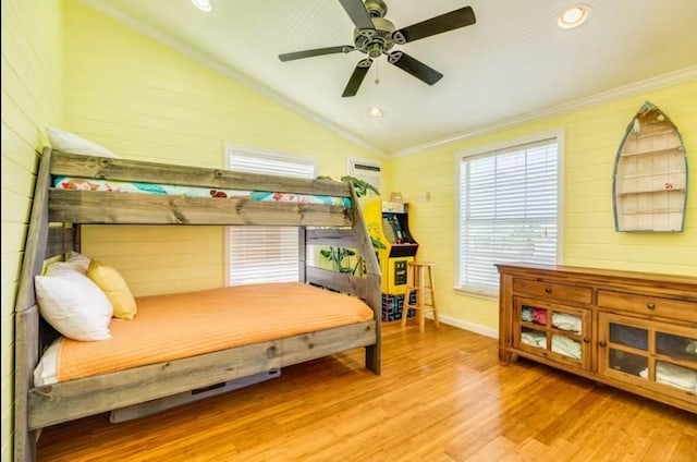 16530 Jean Lafitte Rd, Jamaica Beach, TX 77554 - bedroom featuring crown molding, wood walls, wood finished floors, baseboards, and vaulted ceiling