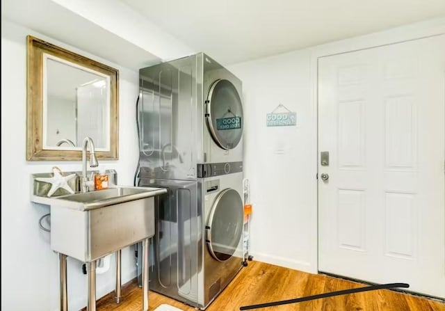 16530 Jean Lafitte Rd, Jamaica Beach, TX 77554 - washroom with laundry area, stacked washer / dryer, and wood finished floors