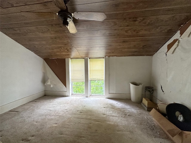 additional living space featuring vaulted ceiling and wood ceiling
