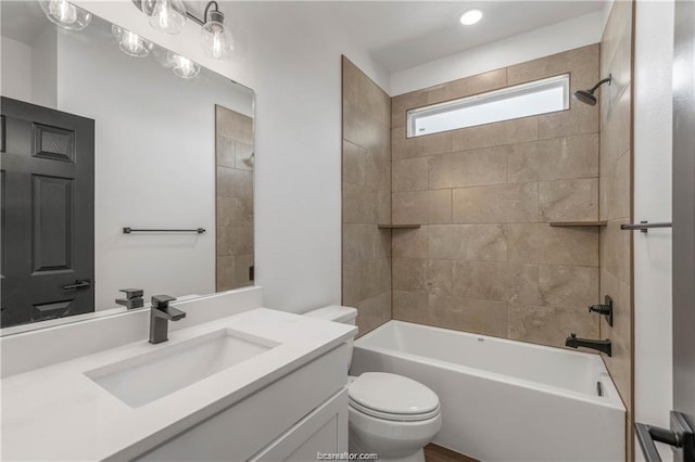 bathroom featuring toilet, recessed lighting, shower / tub combination, and vanity