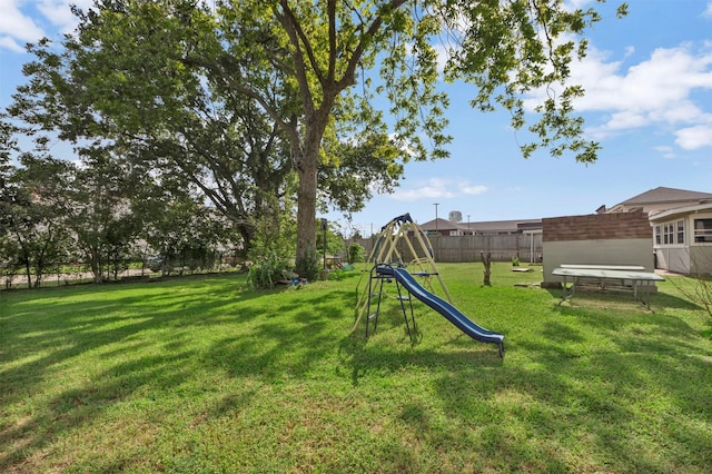808 Morrell St, Baytown, TX 77520 - view of yard with a playground and fence