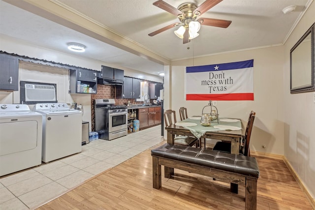 808 Morrell St, Baytown, TX 77520 - dining space with light wood-style floors, ornamental molding, a ceiling fan, and washing machine and clothes dryer
