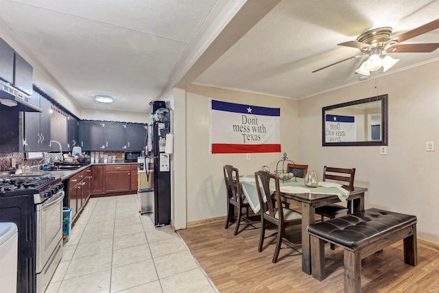 808 Morrell St, Baytown, TX 77520 - dining room with ceiling fan, baseboards, and light wood-type flooring