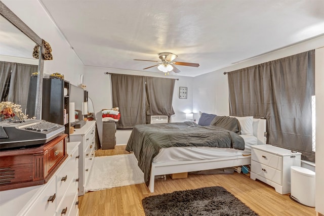 808 Morrell St, Baytown, TX 77520 - bedroom featuring light wood finished floors, ceiling fan, and cooling unit
