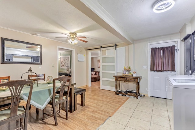 808 Morrell St, Baytown, TX 77520 - dining area with ornamental molding, independent washer and dryer, and a barn door