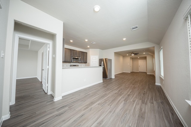 unfurnished living room with recessed lighting, baseboards, light wood finished floors, and visible vents