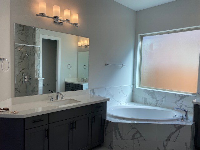 4418 Southpoint Way N, Fulshear, TX 77441 - bathroom featuring a garden tub, vanity, and a marble finish shower