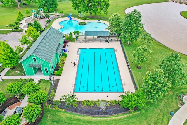 4418 Southpoint Way N, Fulshear, TX 77441 - drone / aerial view of a pool area and a nearby body of water