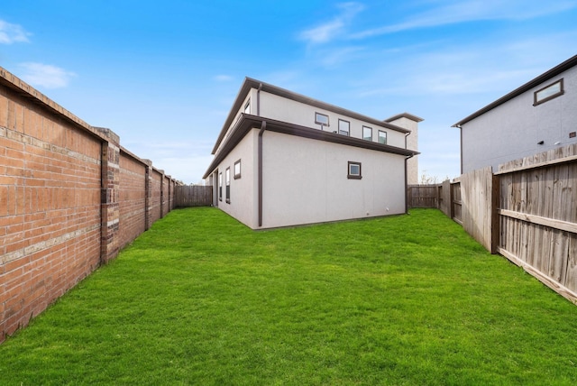 view of yard with a fenced backyard