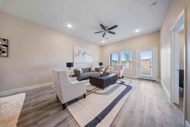 living room with recessed lighting, baseboards, ceiling fan, and light wood finished floors