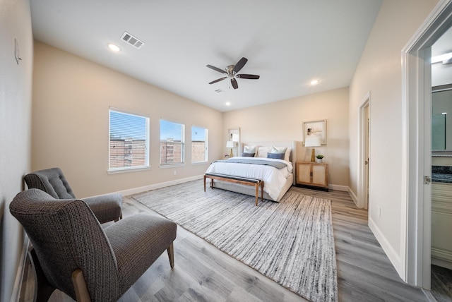 bedroom with ceiling fan, recessed lighting, baseboards, wood finished floors, and visible vents
