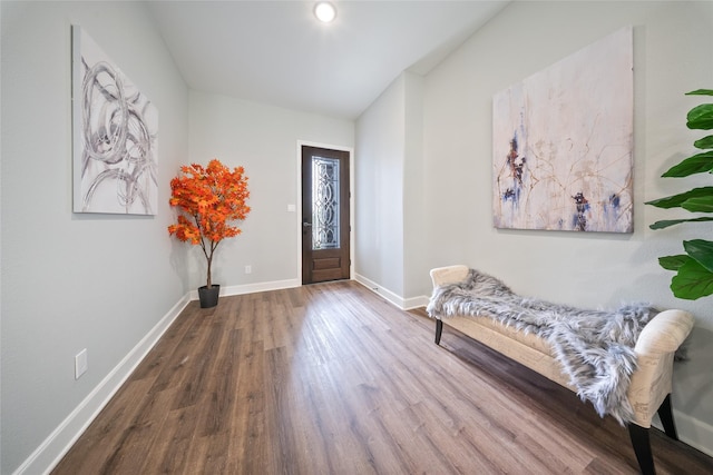 entryway with baseboards and wood finished floors