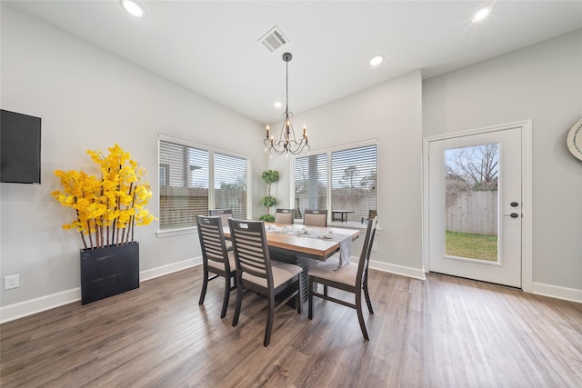 dining area featuring an inviting chandelier, visible vents, wood finished floors, baseboards, and recessed lighting