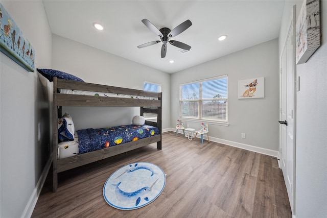 bedroom featuring recessed lighting, baseboards, ceiling fan, and wood finished floors