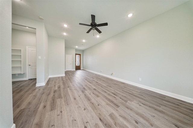 unfurnished living room featuring baseboards, ceiling fan, recessed lighting, and wood finished floors