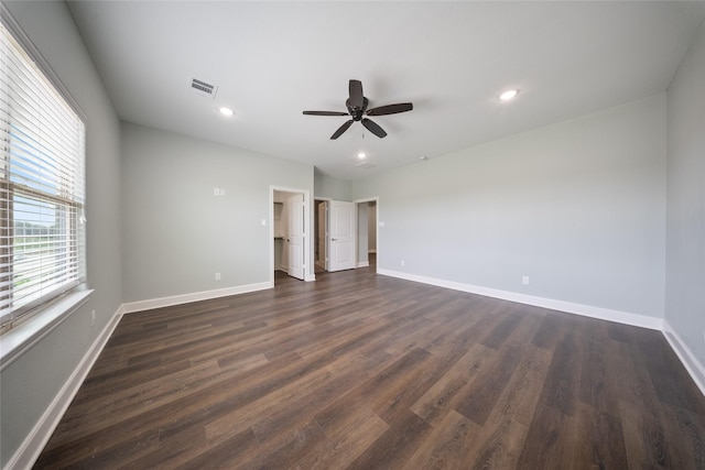 unfurnished bedroom with baseboards, a ceiling fan, recessed lighting, and dark wood-type flooring