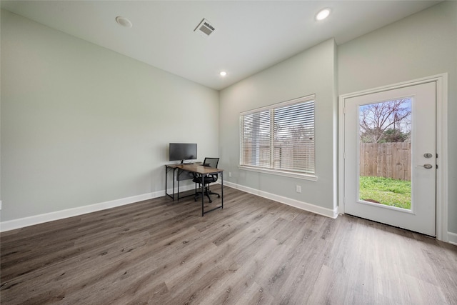 office area with recessed lighting, baseboards, visible vents, and wood finished floors