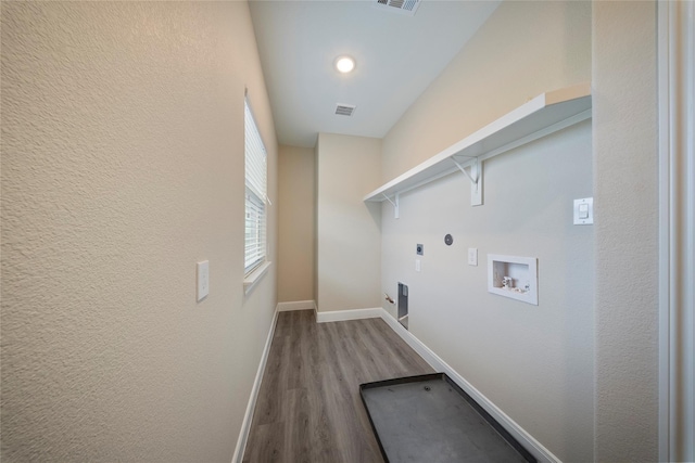 washroom featuring laundry area, electric dryer hookup, wood finished floors, baseboards, and hookup for a washing machine