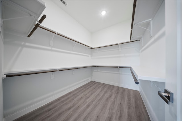 spacious closet with visible vents and wood finished floors