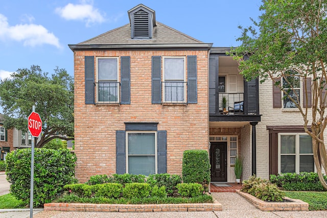 3749 Wakeforest St, Houston, TX 77098 - view of front facade with a balcony and brick siding